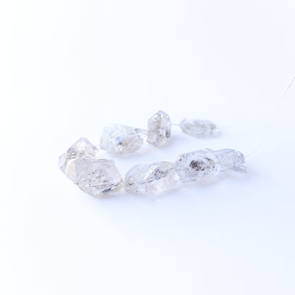 Genuine Herkimer Diamond drilled rough gemstone beads showcasing bold clarity and raw sparkle.
