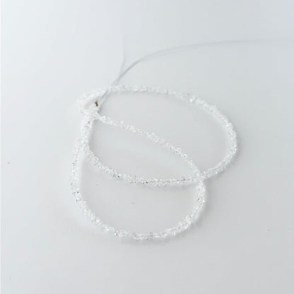 Small Herkimer Diamond chips arranged neatly, highlighting their raw finish and handmade jewellery component quality