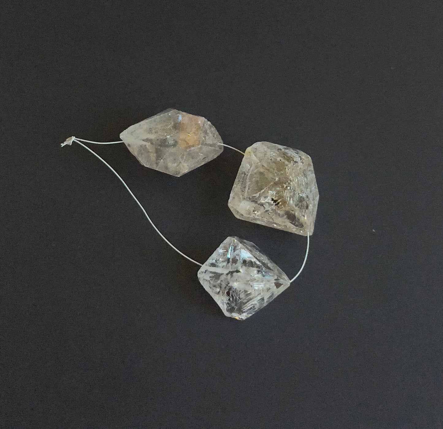 Handmade jewellery components with drilled Herkimer Diamond beads in irregular shapes.