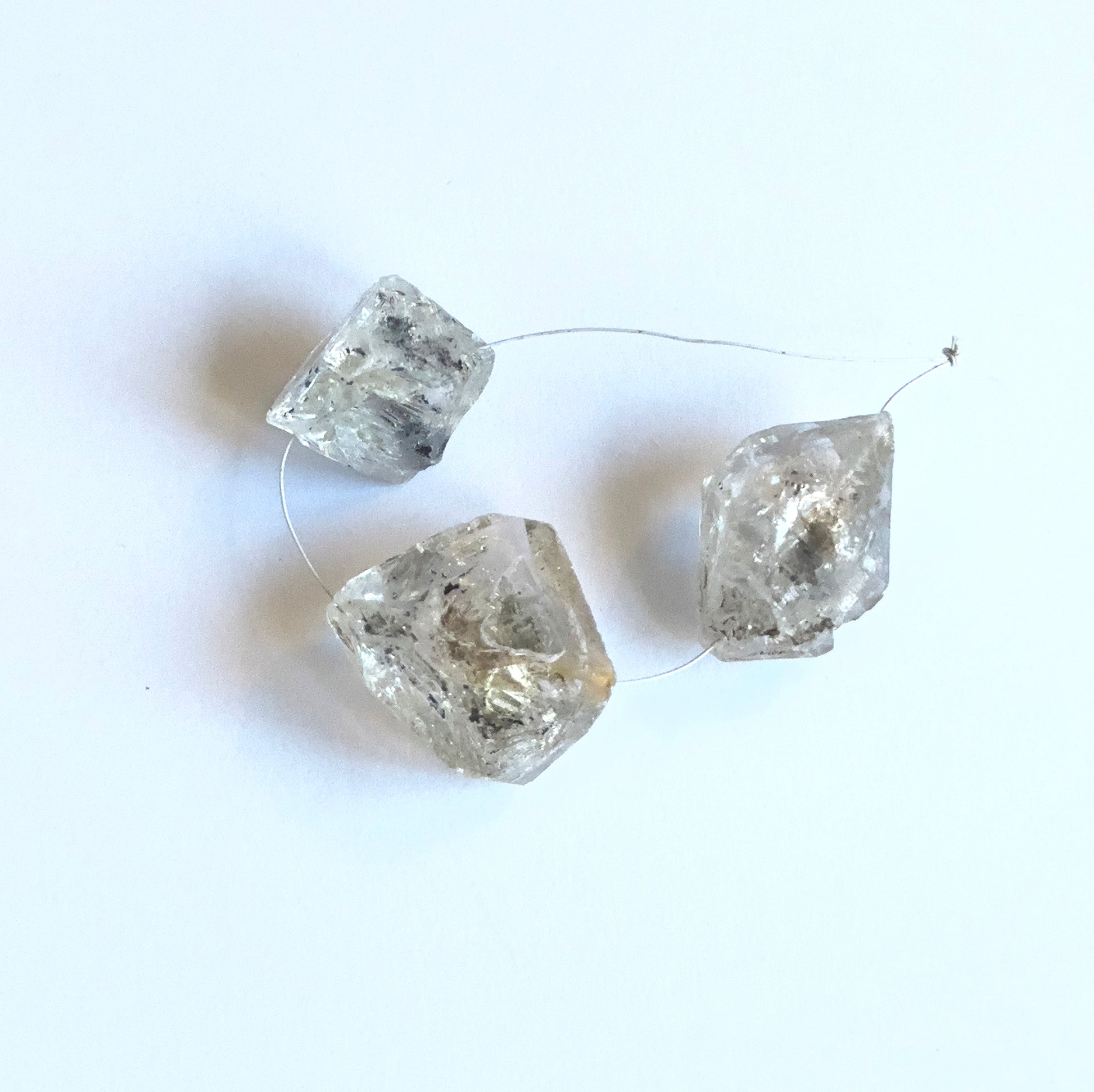 Natural gemstone beads for DIY jewellery showcasing drilled Herkimer Diamond in large rough cut.