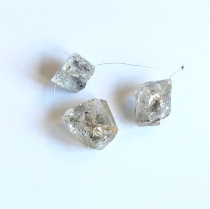 Natural gemstone beads for DIY jewellery showcasing drilled Herkimer Diamond in large rough cut.