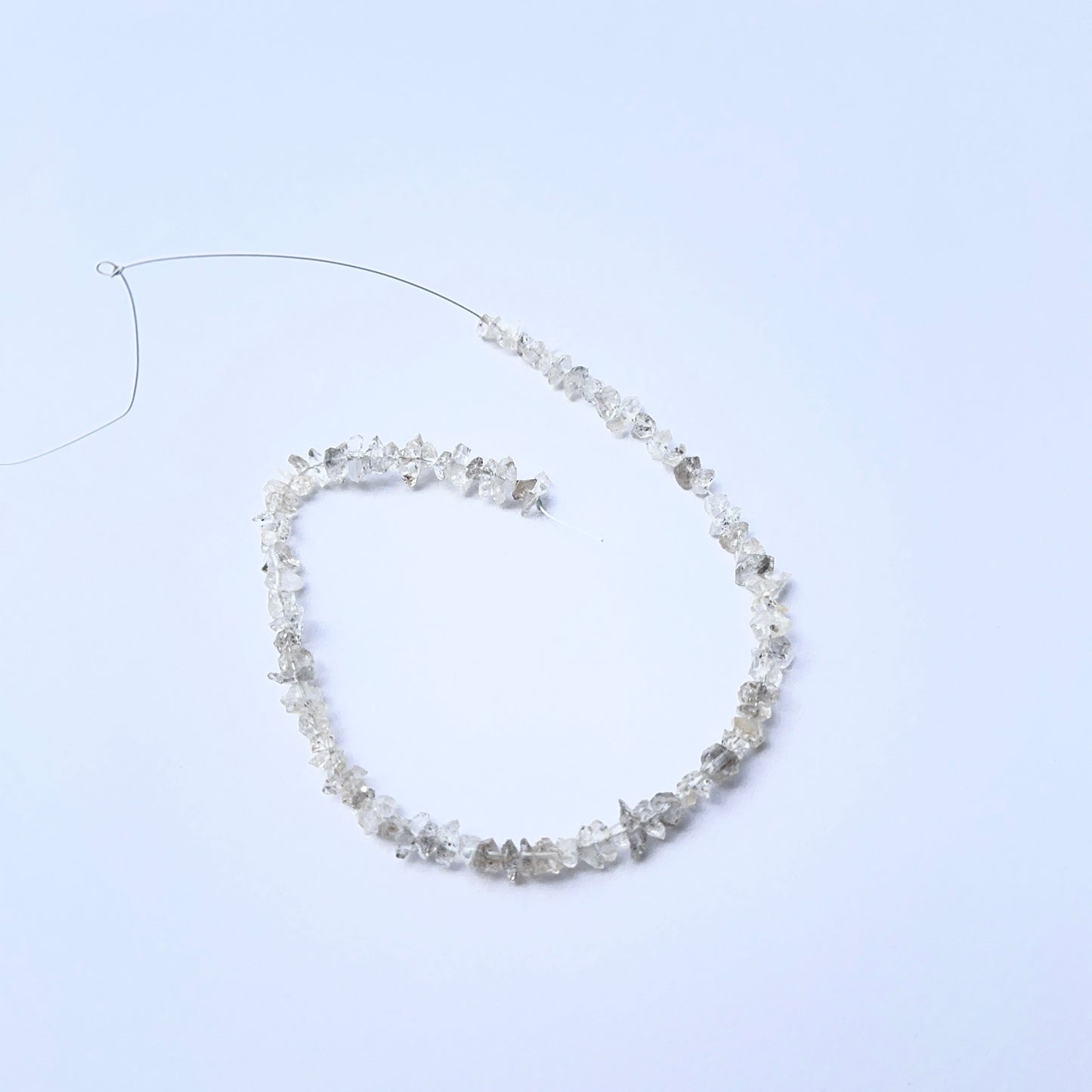 Herkimer Diamond rough stones arranged neatly to showcase gemstone quality and brilliance.