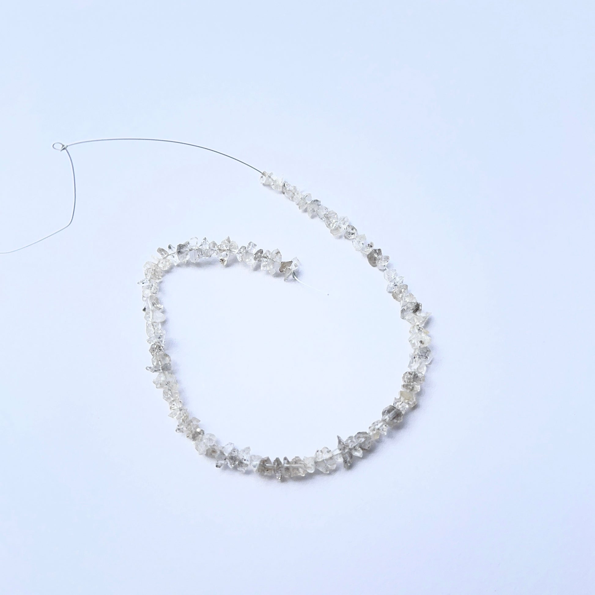 Herkimer Diamond rough stones arranged neatly to showcase gemstone quality and brilliance.