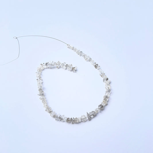 Herkimer Diamond rough stones arranged neatly to showcase gemstone quality and brilliance.