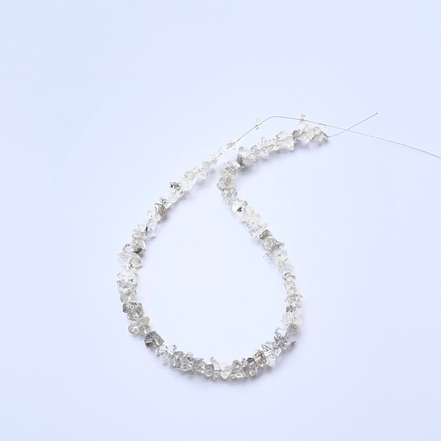 Herkimer Diamond rough beads photographed to show their unpolished finish and sparkle.