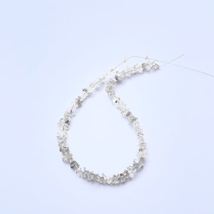 Herkimer Diamond rough beads photographed to show their unpolished finish and sparkle.