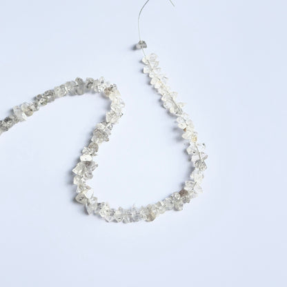 Herkimer Diamond rough stones arranged neatly to showcase natural gemstone quality and brilliance.