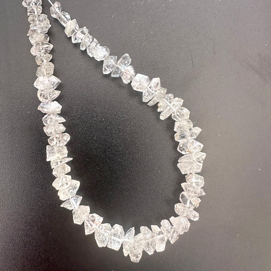 Centre-drilled Herkimer gemstones with double-terminated points and radiant spar