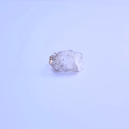 Natural Herkimer Diamond stone with uncut facets and earthy character.