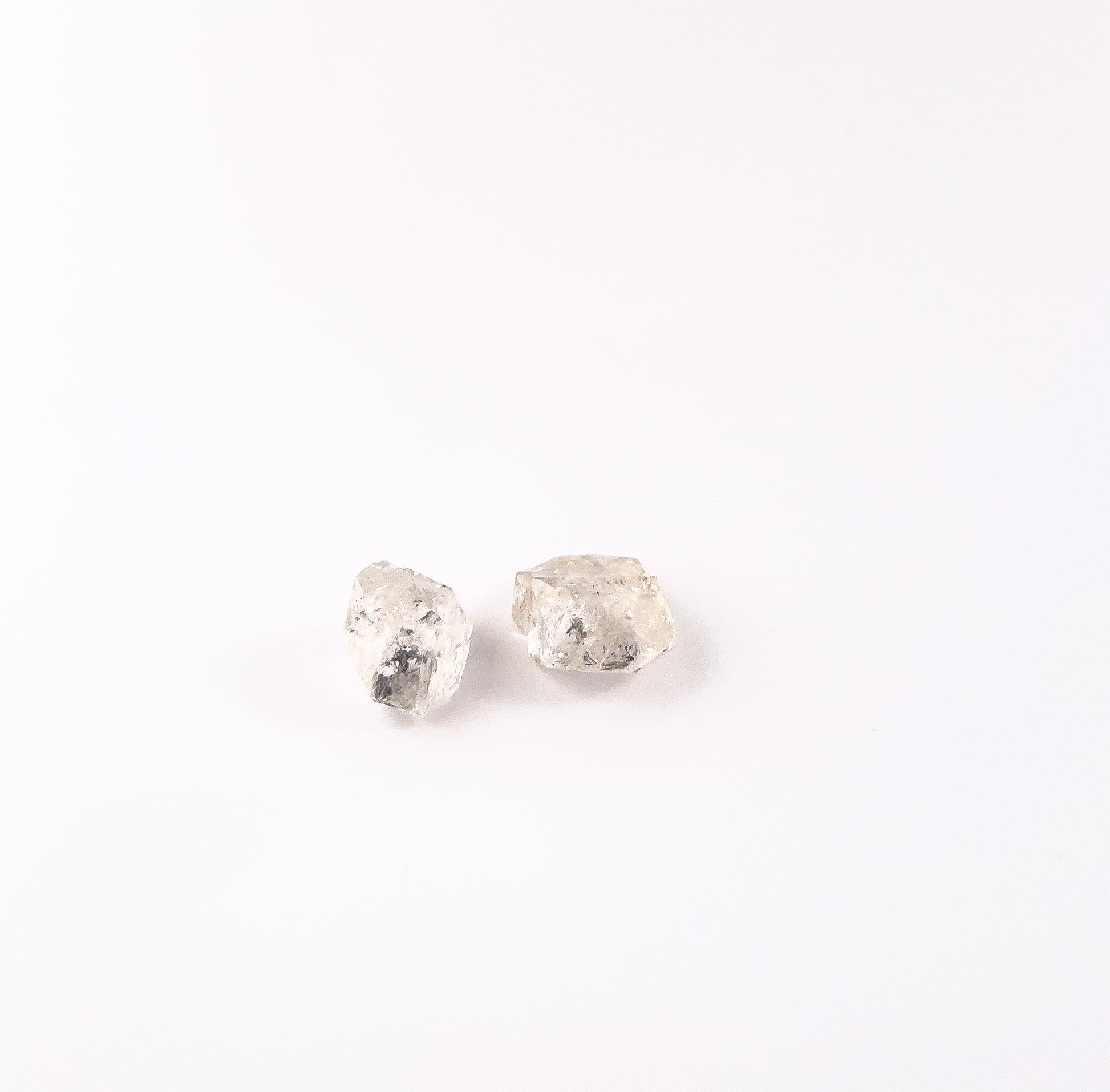 Handpicked Herkimer Diamond undrilled rough gemstones displaying raw sparkle, natural inclusions and crisp geometric edges.