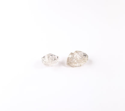 Herkimer Diamond undrilled rough crystals sized 24–25mm, showcasing natural double‑terminated clarity in a 131‑carat selection.