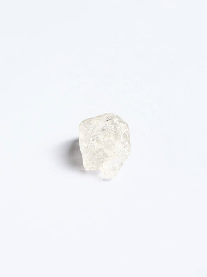 Large Herkimer Diamond rough piece arranged on a white background showcasing its brilliance.