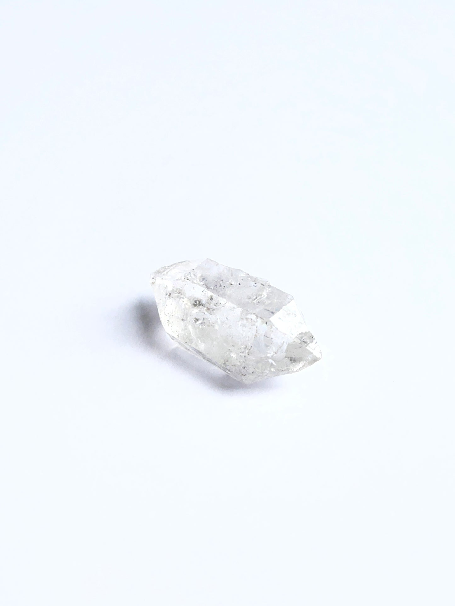 Raw Herkimer Diamond displayed with visible crystalline structure ideal for gemstone crafting.