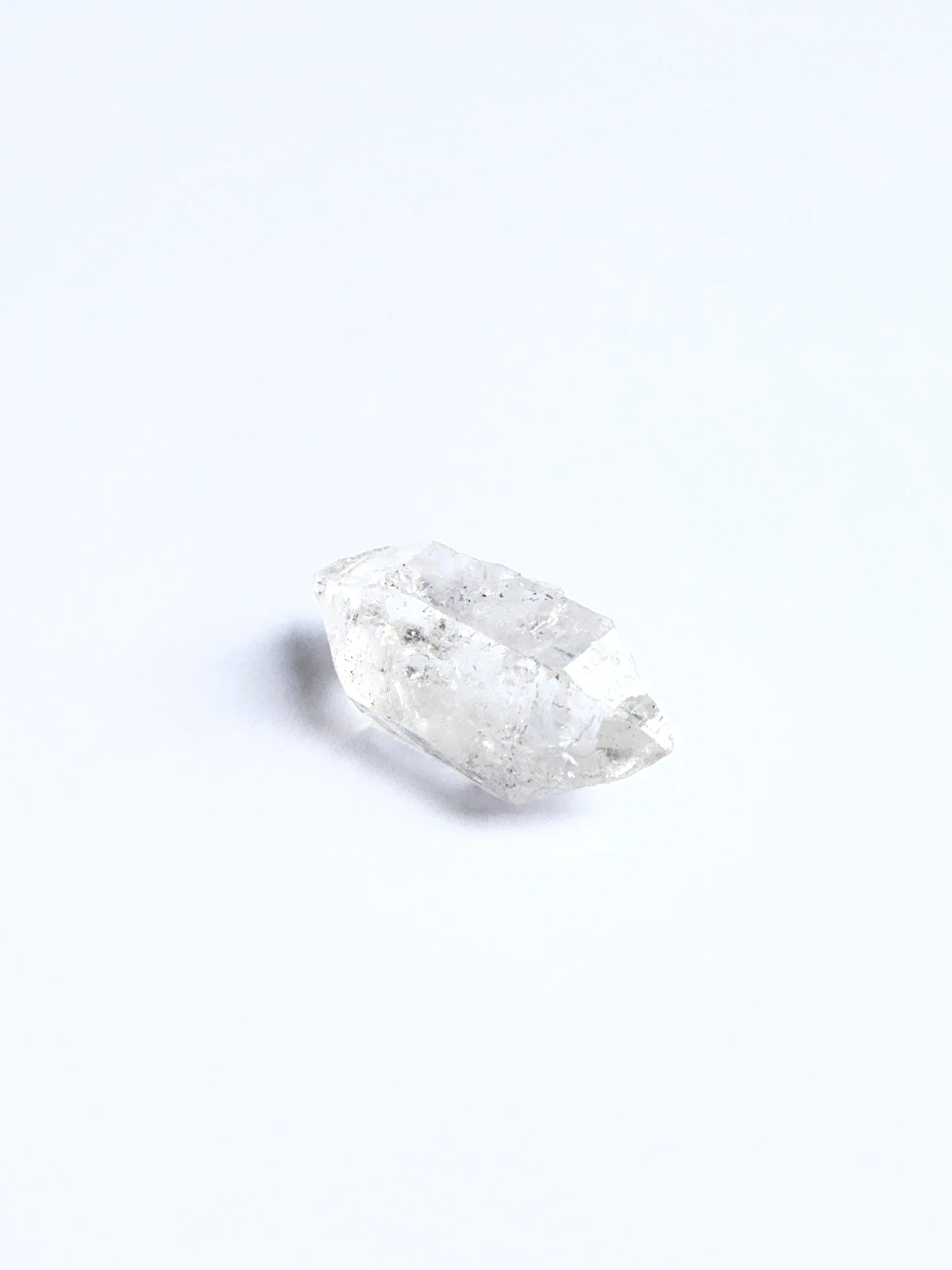 Raw Herkimer Diamond displayed with visible crystalline structure ideal for gemstone crafting.