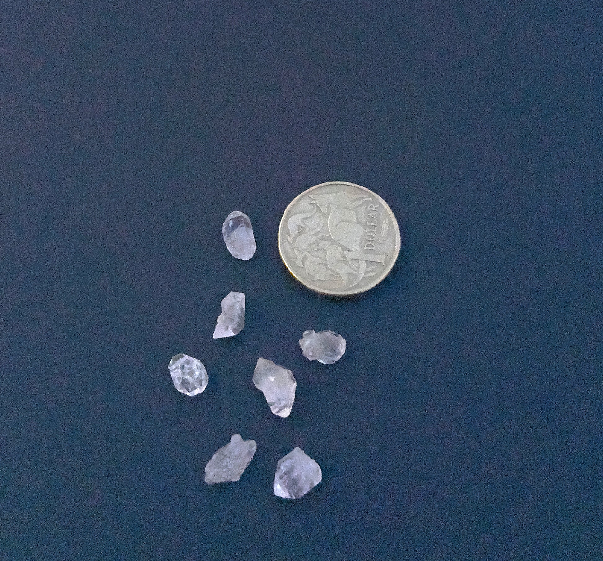 Handmade jewellery components with raw Herkimer Diamond beads in irregular forms. Detailed view of 6–7mm undrilled Herkimer Diamond beads with bright crystal shine. 