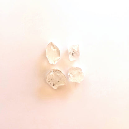 Herkimer diamond crystals with uncut surfaces and organic brilliance.
