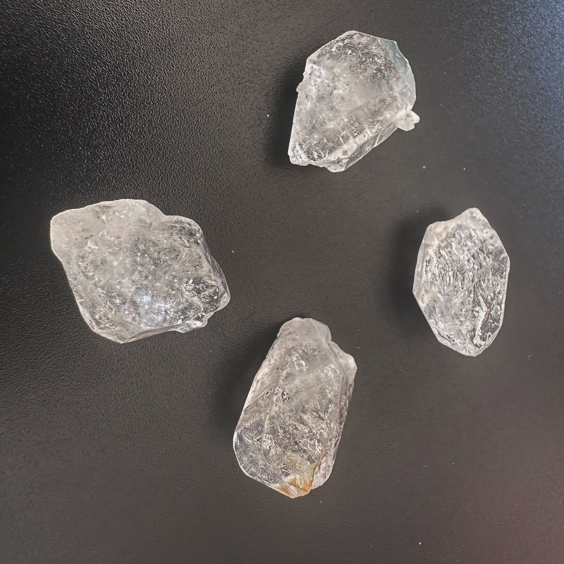 Close-up of undrilled Herkimer crystals showing double-terminated facets and high transparency.