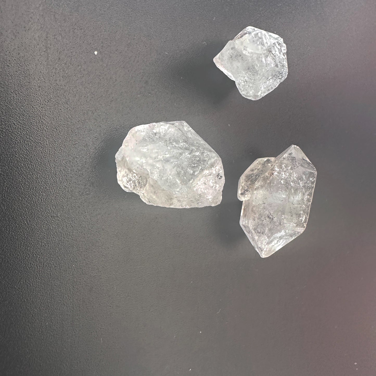Uncut Herkimer gemstones with brilliant shine and organic formation.