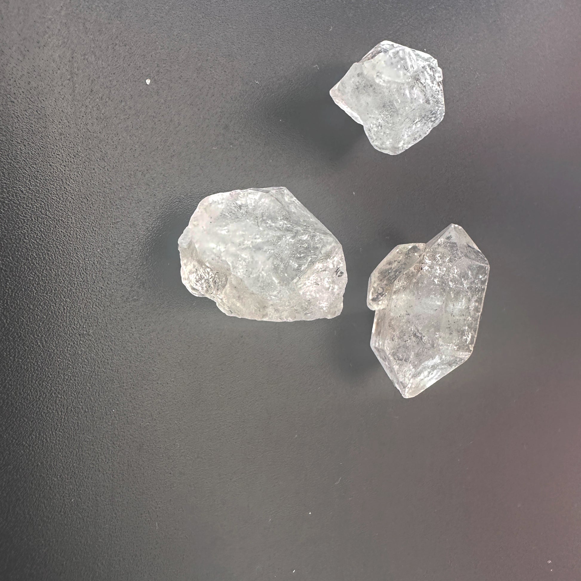 Uncut Herkimer gemstones with brilliant shine and organic formation.