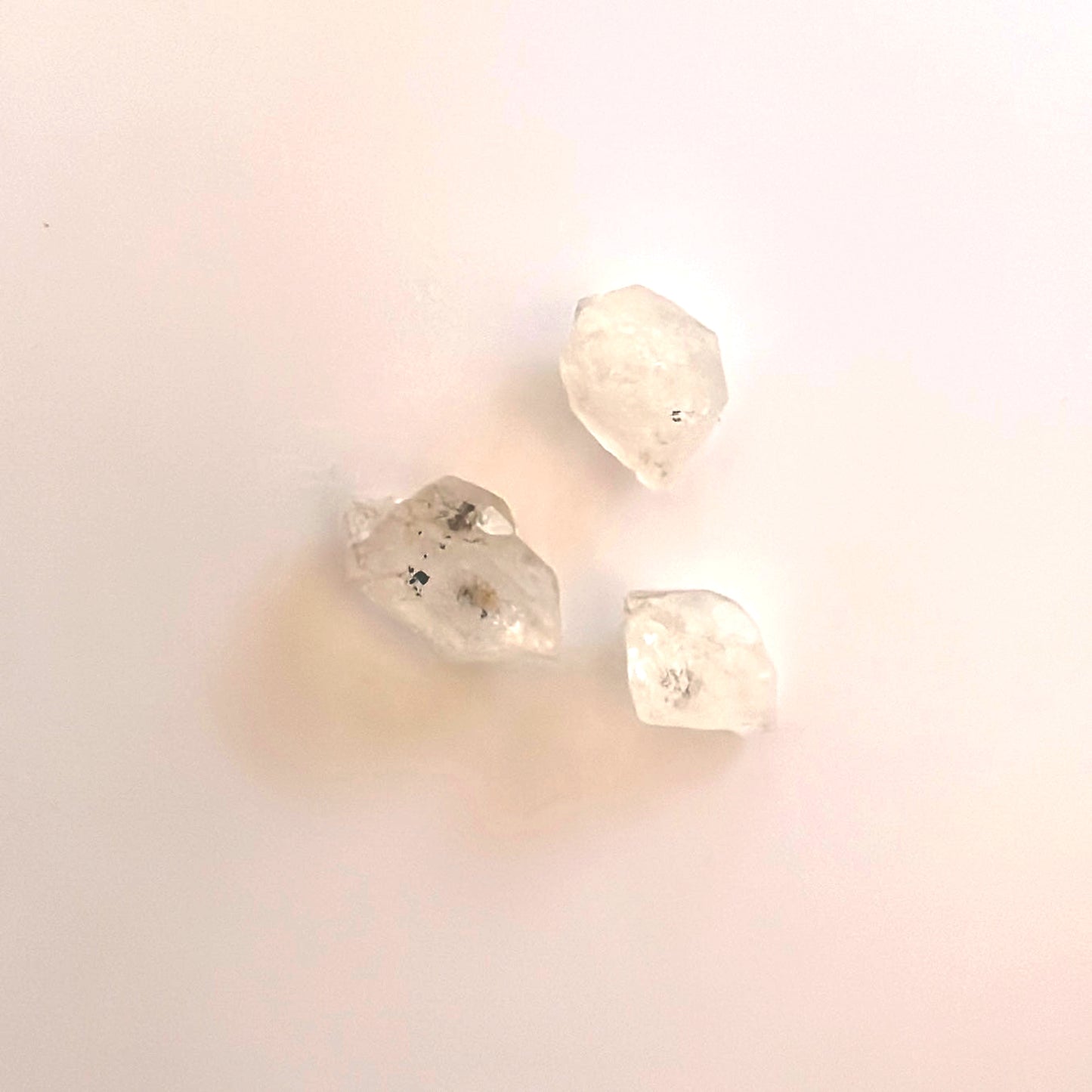 Detailed view of Herkimer undrilled stones with luminous clarity and unique structure.