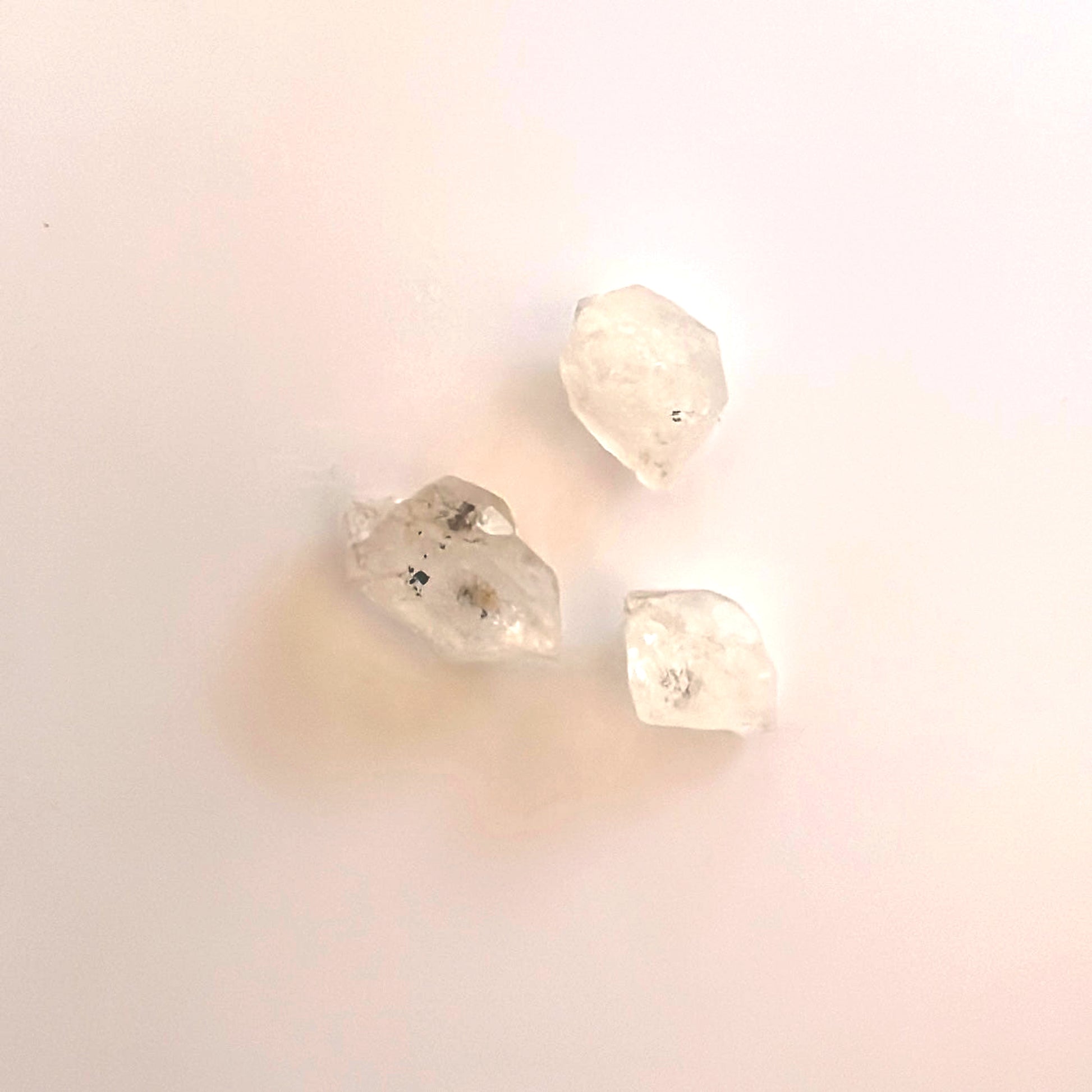Detailed view of Herkimer undrilled stones with luminous clarity and unique structure.