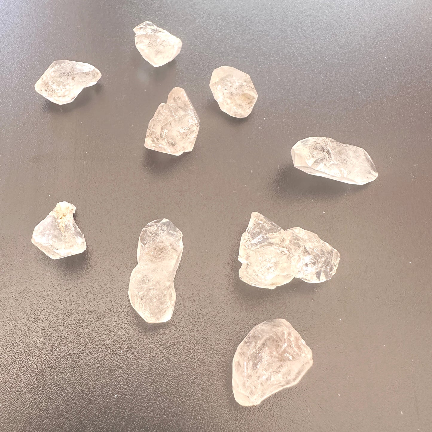 Detailed view of Herkimer undrilled crystals with rugged surfaces and clarity.