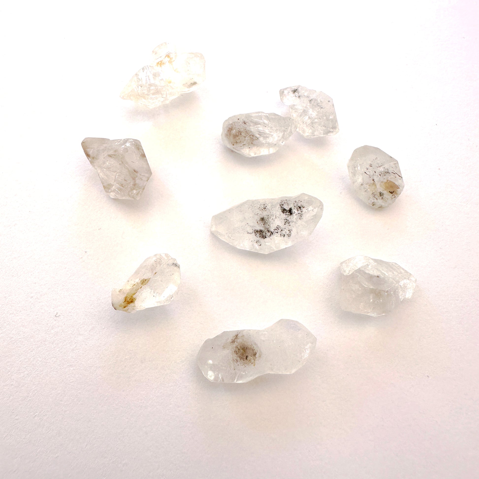 Detailed view of Herkimer undrilled crystals with rugged surfaces and clarity.