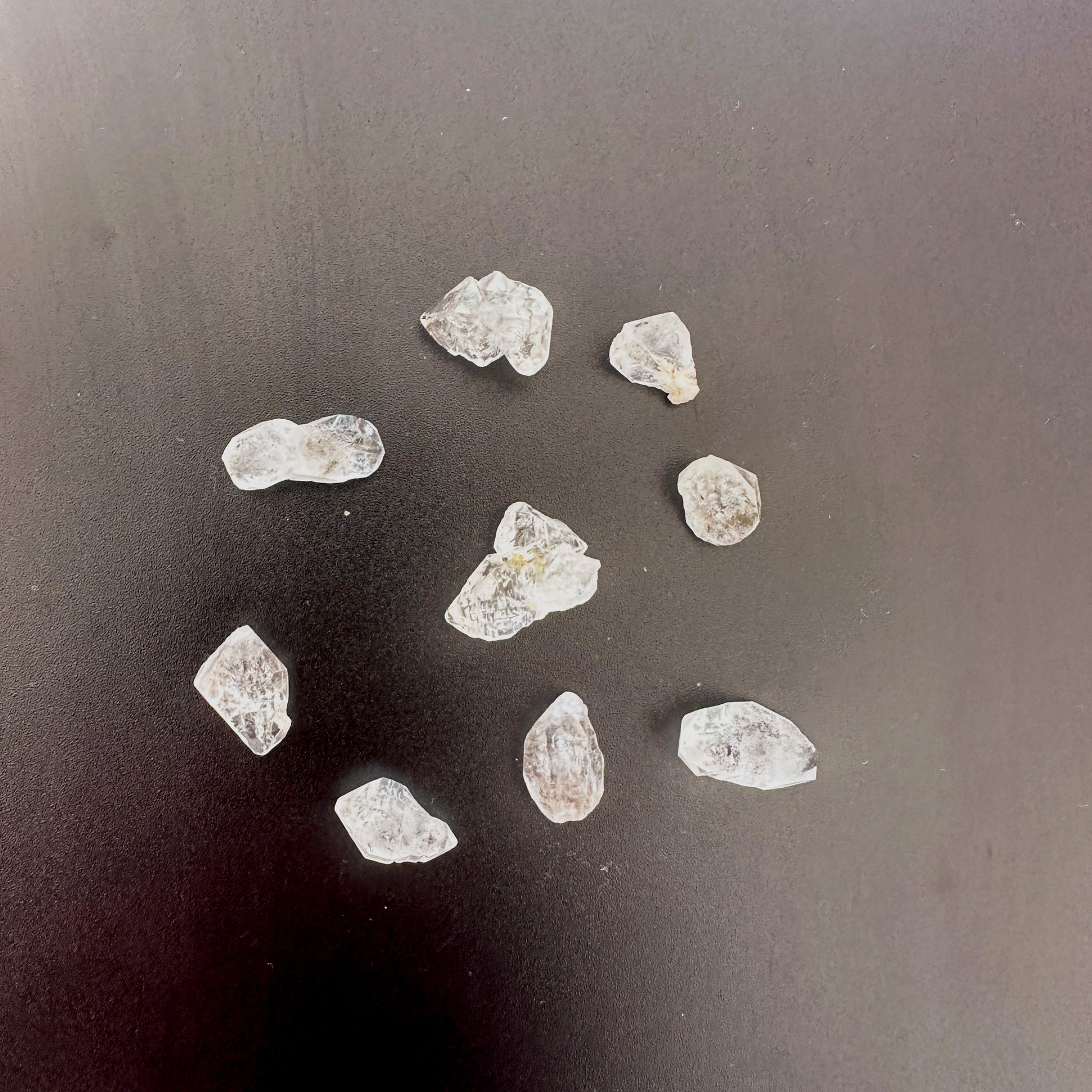Close-up of Herkimer quartz nuggets showing double-terminated points and icy brilliance.