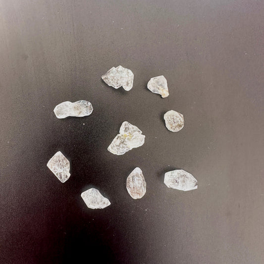 Close-up of Herkimer quartz nuggets showing double-terminated points and icy brilliance.