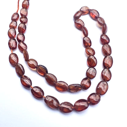Handmade jewellery components with smooth oval Hessonite beads in 7.5–9mm length and 6mm breadth. 