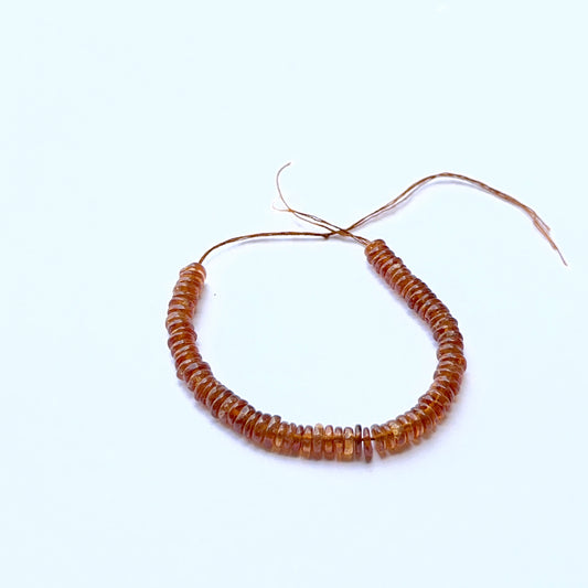 Hessonite smooth wheel natural gemstone beads in 4.5–4.7mm on a 10cm strand, showing warm honey‑brown tones for DIY jewellery.