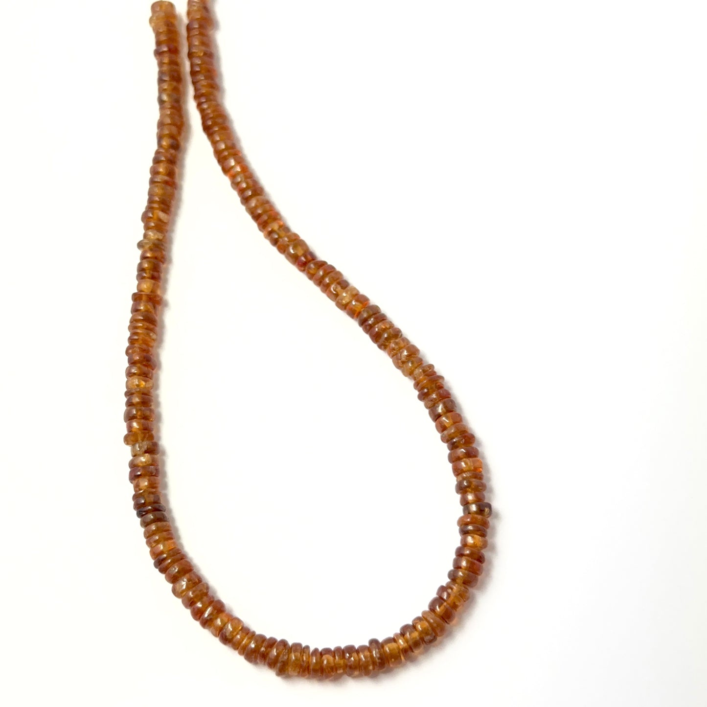 Golden‑brown Hessonite wheel‑cut beads with soft shine, perfect for genuine gemstone beads in creative designs.