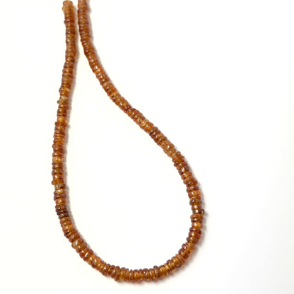 Golden‑brown Hessonite wheel‑cut beads with soft shine, perfect for genuine gemstone beads in creative designs.