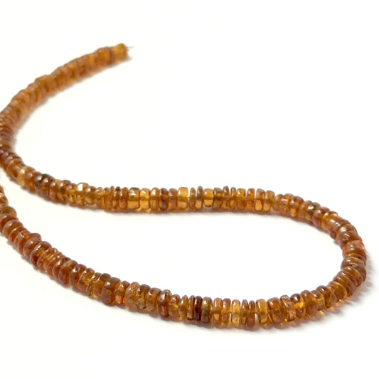 Hessonite smooth wheel beads in warm amber tones, showcasing 4.3–4.6mm stone beads ideal for DIY jewellery.