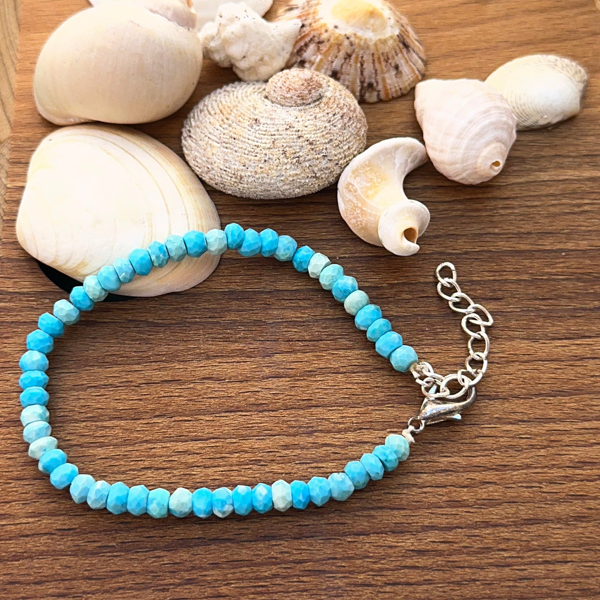 Howlite turquoise bracelet featuring faceted rondelle beads in bright blue tones.