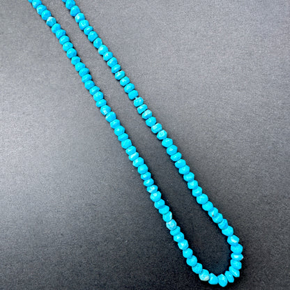 Delicate strands of Howlite Turquoise beads, showcasing their smooth design.