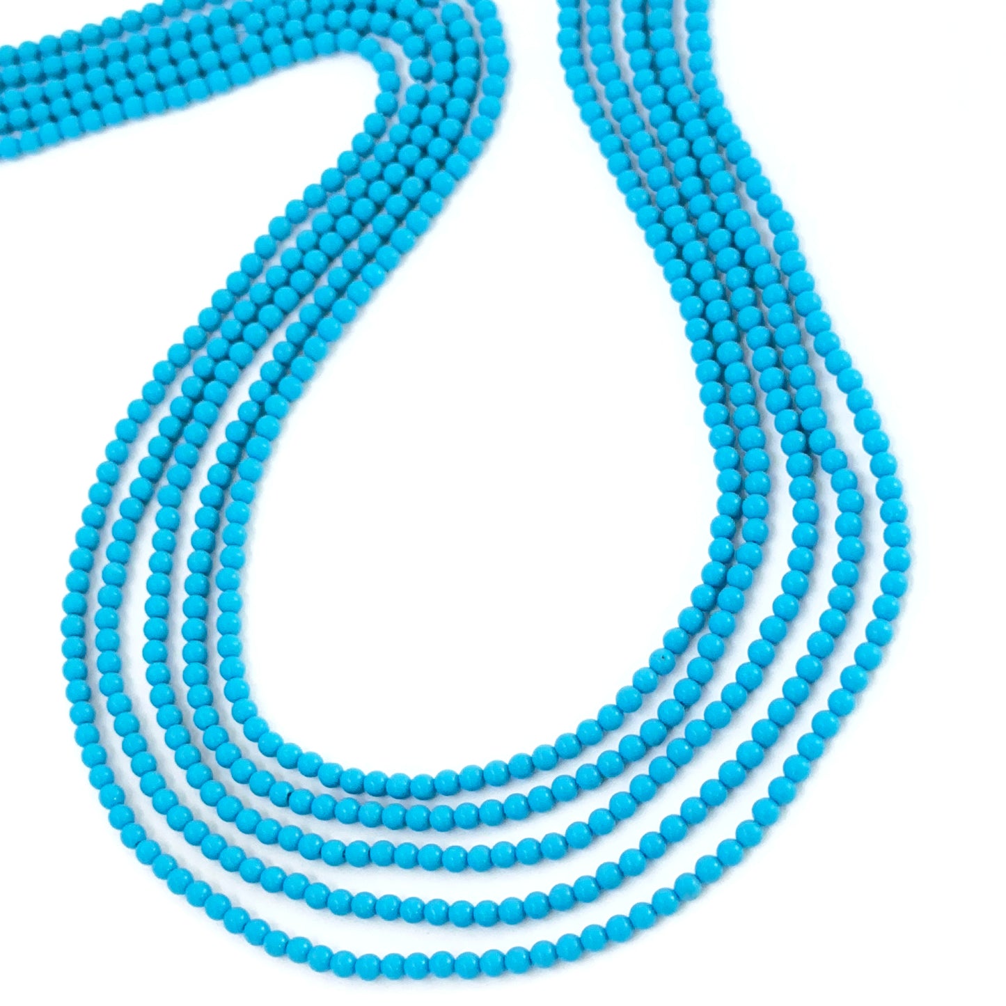 Howlite Turquoise 2.4mm beads with subtle marbling and clean round shape.