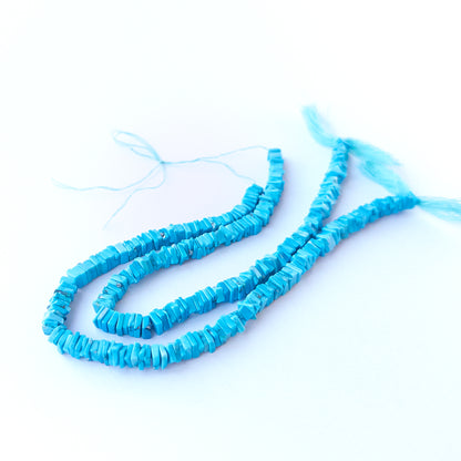 Authentic Howlite Turquoise gemstone beads showcasing clean cube‑like heishi cuts for handmade jewellery components.