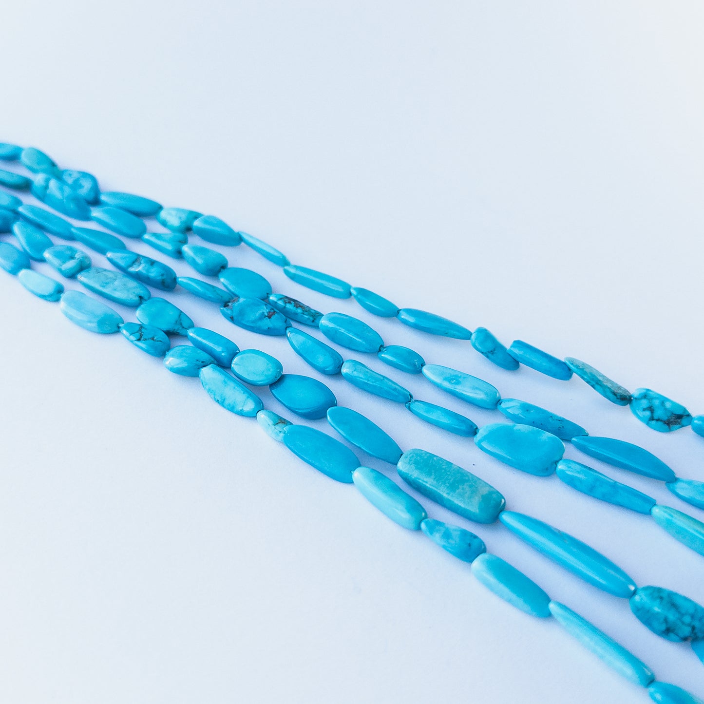 High‑quality Howlite Turquoise tumble beads with soothing blue shades perfect for gemstone bead jewellery making.