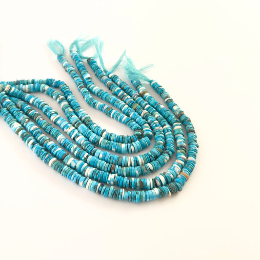 Howlite Turquoise smooth wheel heishi beads sized 5–5.5mm arranged in a 20cm strand, showing bright turquoise‑blue colour and a polished finish.