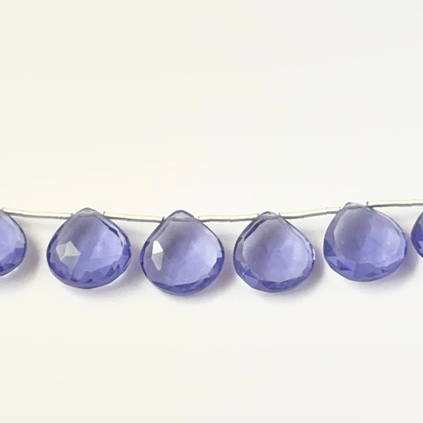 Genuine hydro stone beads in faceted briolette cut, showcasing bright clarity for DIY jewellery design.