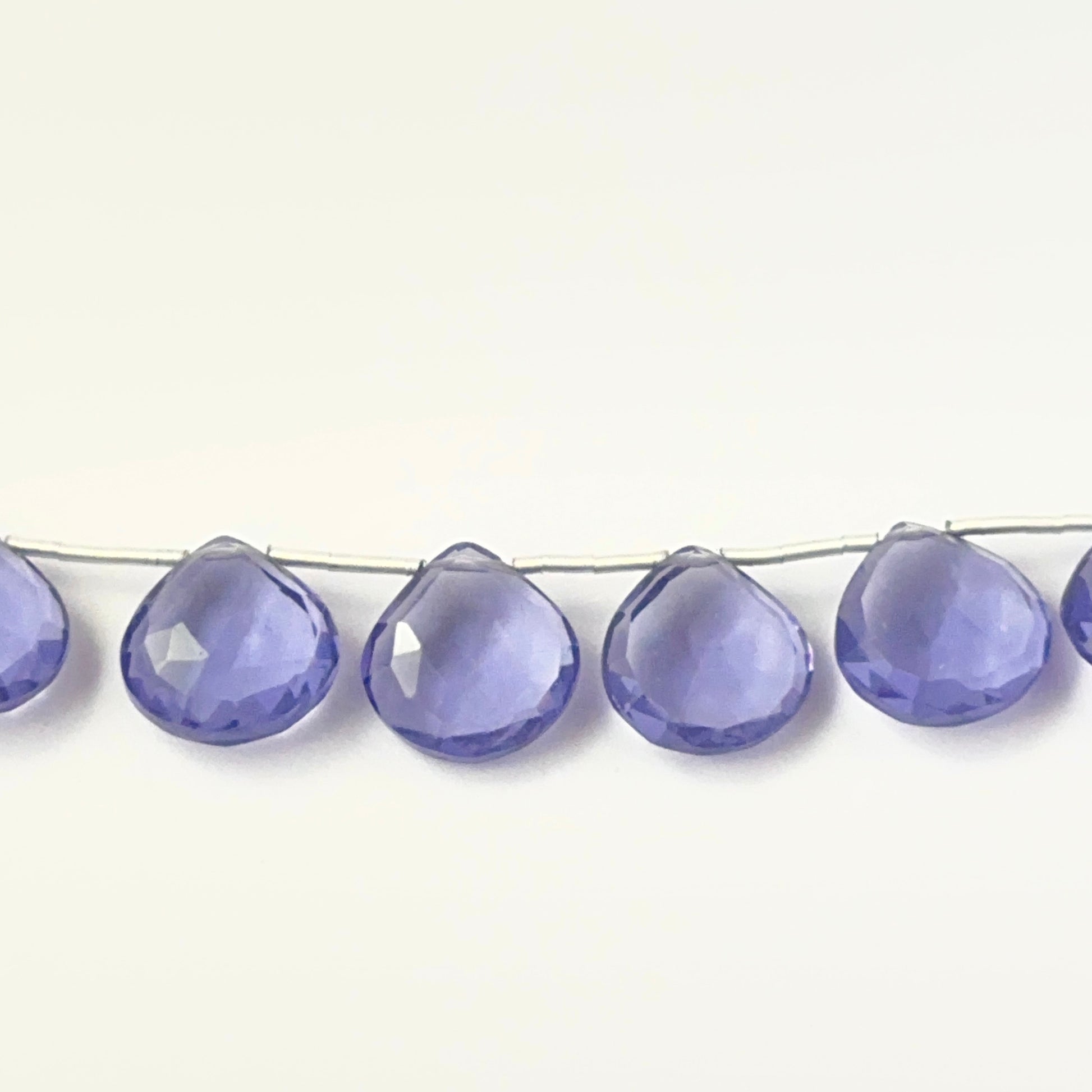 Genuine hydro stone beads in faceted briolette cut, showcasing bright clarity for DIY jewellery design.