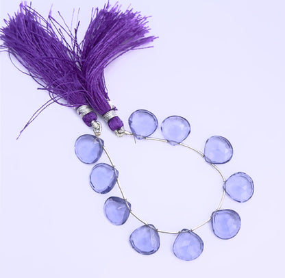Handmade jewellery components featuring Hydro faceted heart briolette beads in rich purple tones.