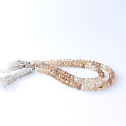 Delicate Imperial Topaz faceted rondelles showcasing brilliance and clarity for DIY gemstone designs.