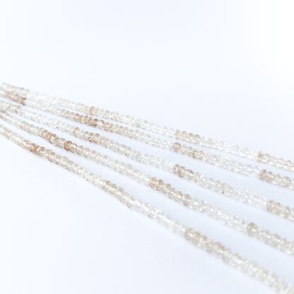 Imperial White Topaz rondelle beads showcasing natural shine and elegant faceting for gemstone bead creators.