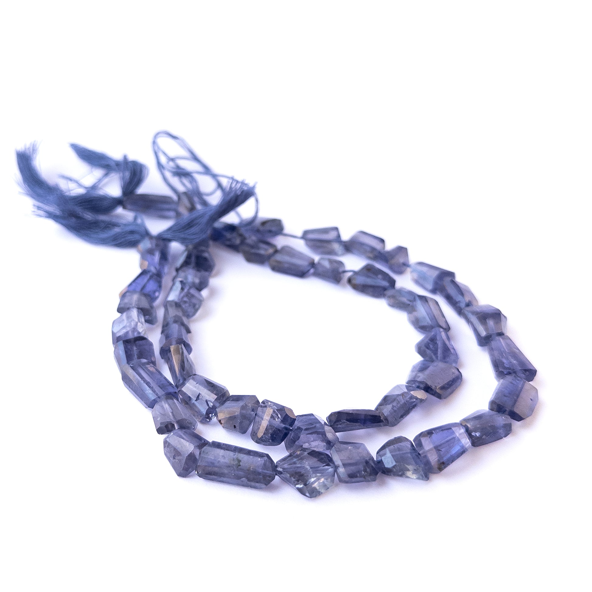 Iolite faceted tumble beads in 8–10mm size on a 25cm strand, showcasing genuine gemstone sparkle.