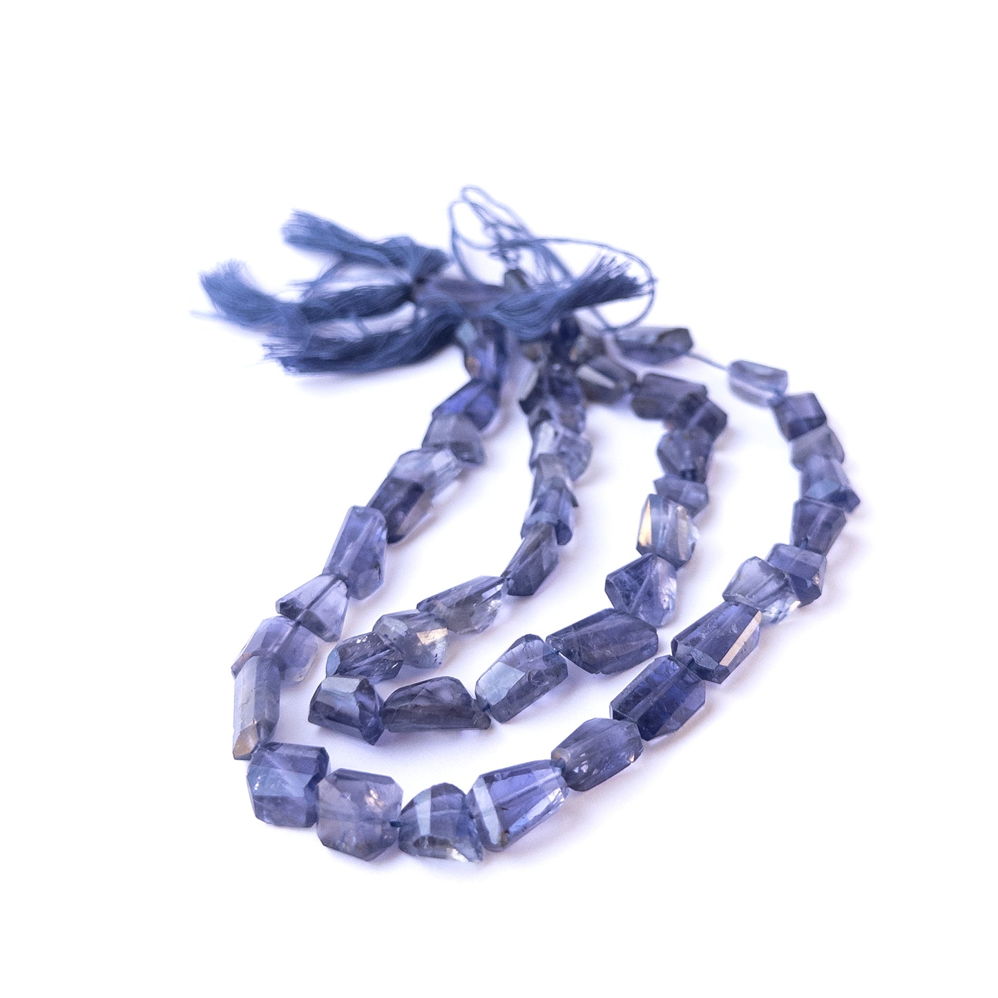 Authentic iolite gemstone beads with polished faceted tumble cuts, ideal for handmade jewellery components.