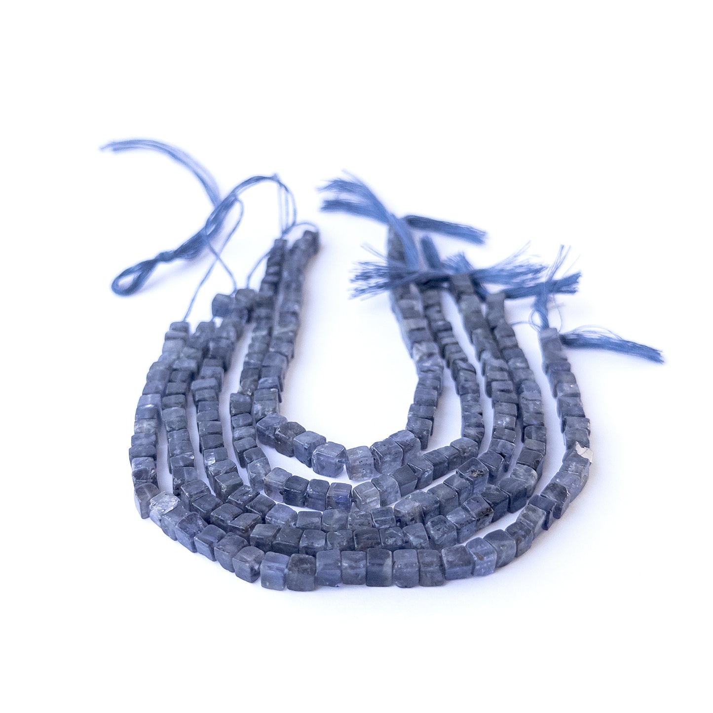 Genuine iolite stone beads with polished smooth cube shaping, ideal for DIY jewellery and artisan beadwork.