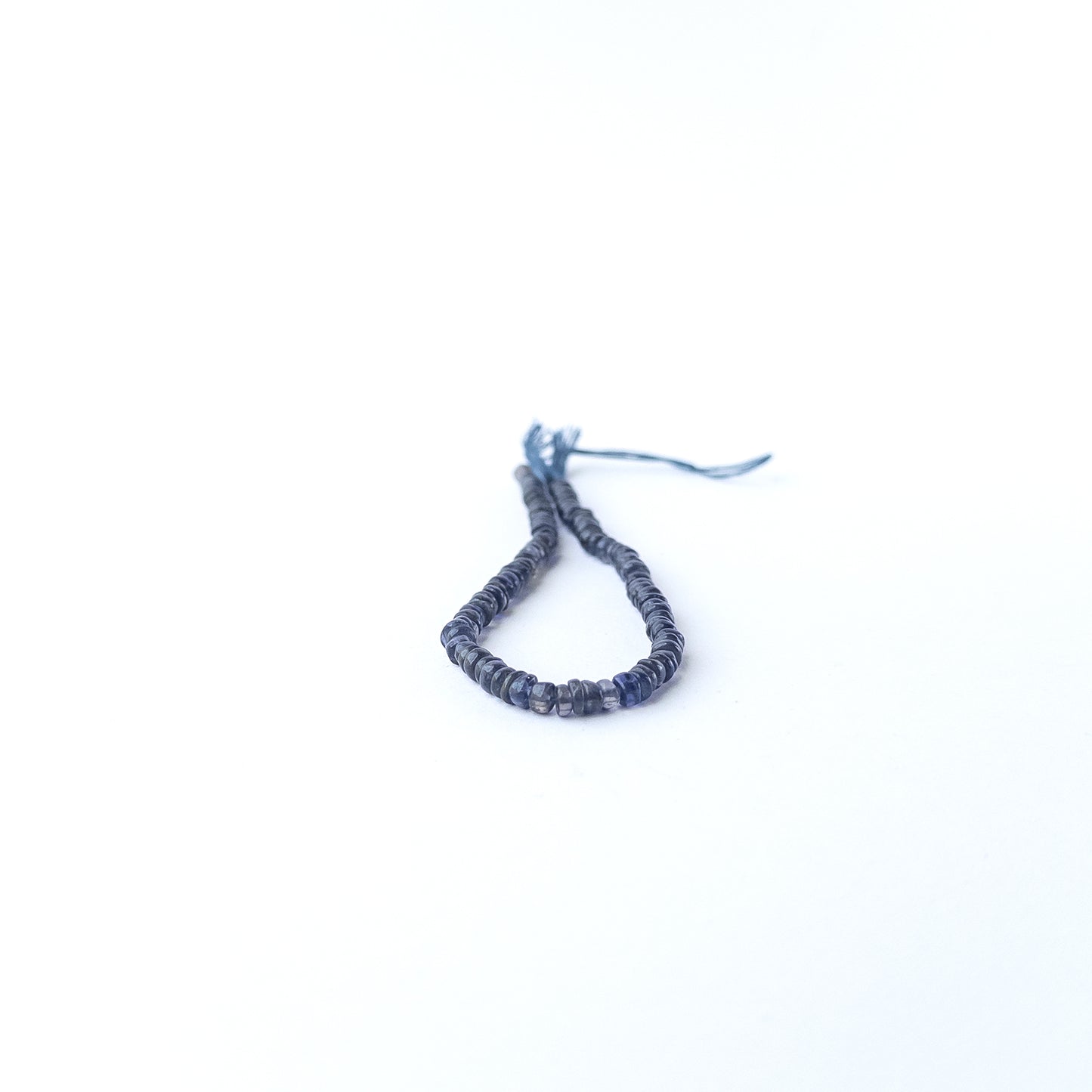 Authentic Iolite gemstone beads showcasing rich colour, smooth wheel shaping and premium bead quality for jewellery designers.