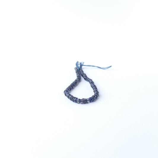 Authentic Iolite gemstone beads showcasing rich colour, smooth wheel shaping and premium bead quality for jewellery designers.